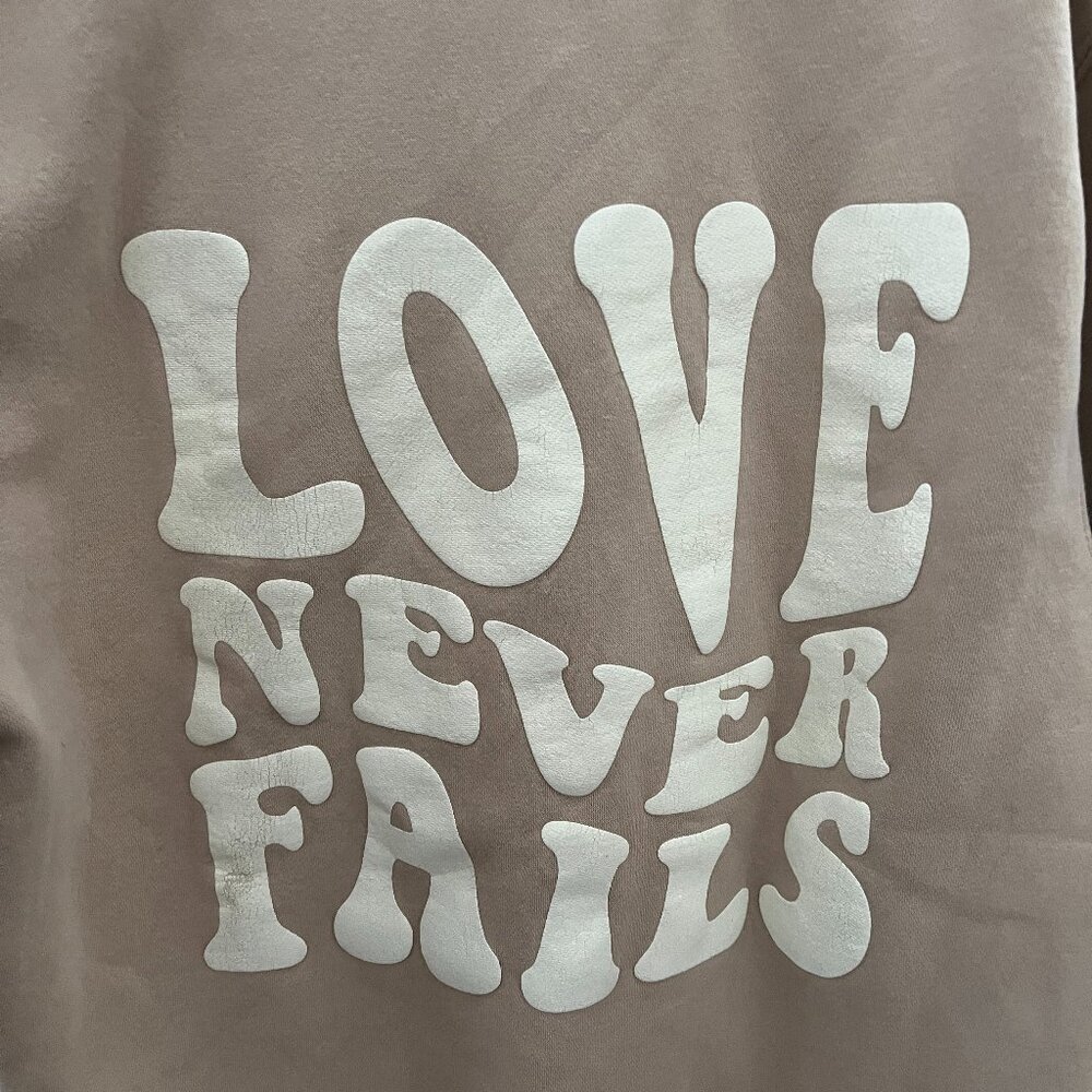 Love never fails hoodie